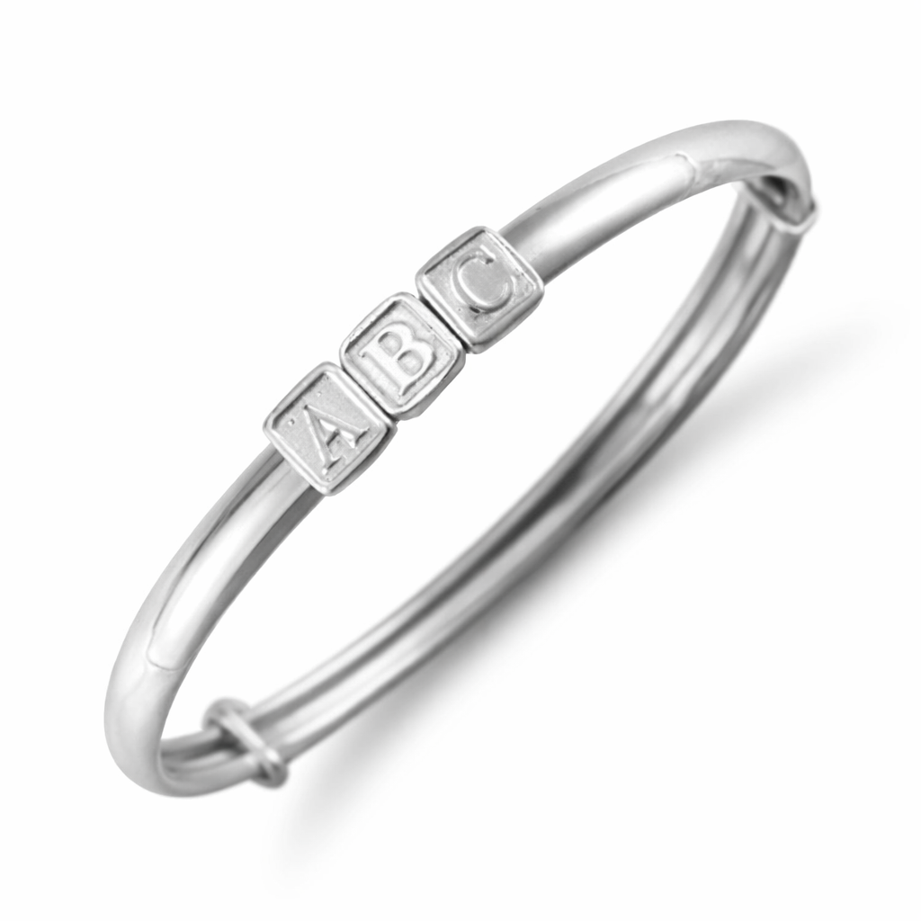 Sterling silver baby bangle by Melchior Jewellery with ABC block letter charms