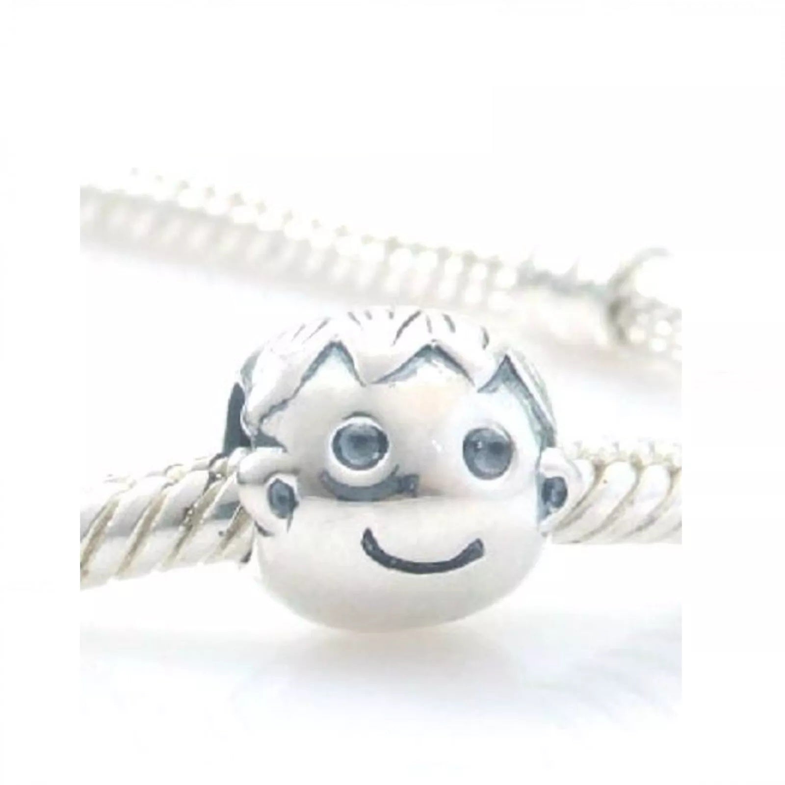 Melchior Jewellery sterling silver boy charm bead with detailed facial features on twisted bracelet