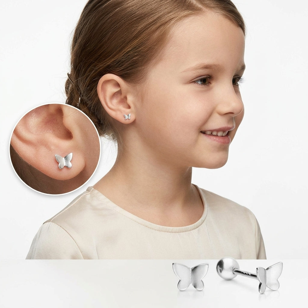 Melchior Jewellery sterling silver butterfly earrings worn by a smiling young girl with light brown hair in a cream top