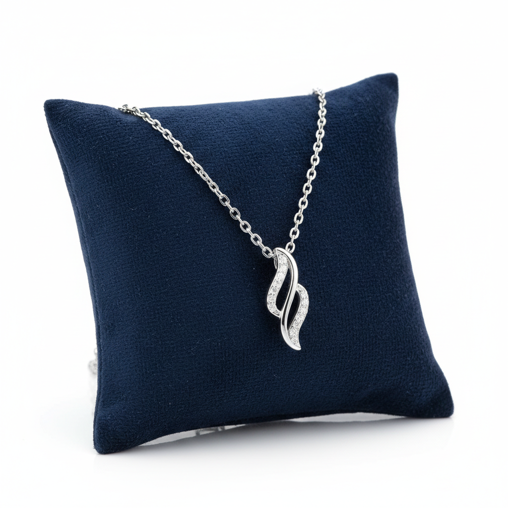 Sentiell sterling silver cubic zirconia necklace with elegant wave pendant on chain displayed on navy cushion