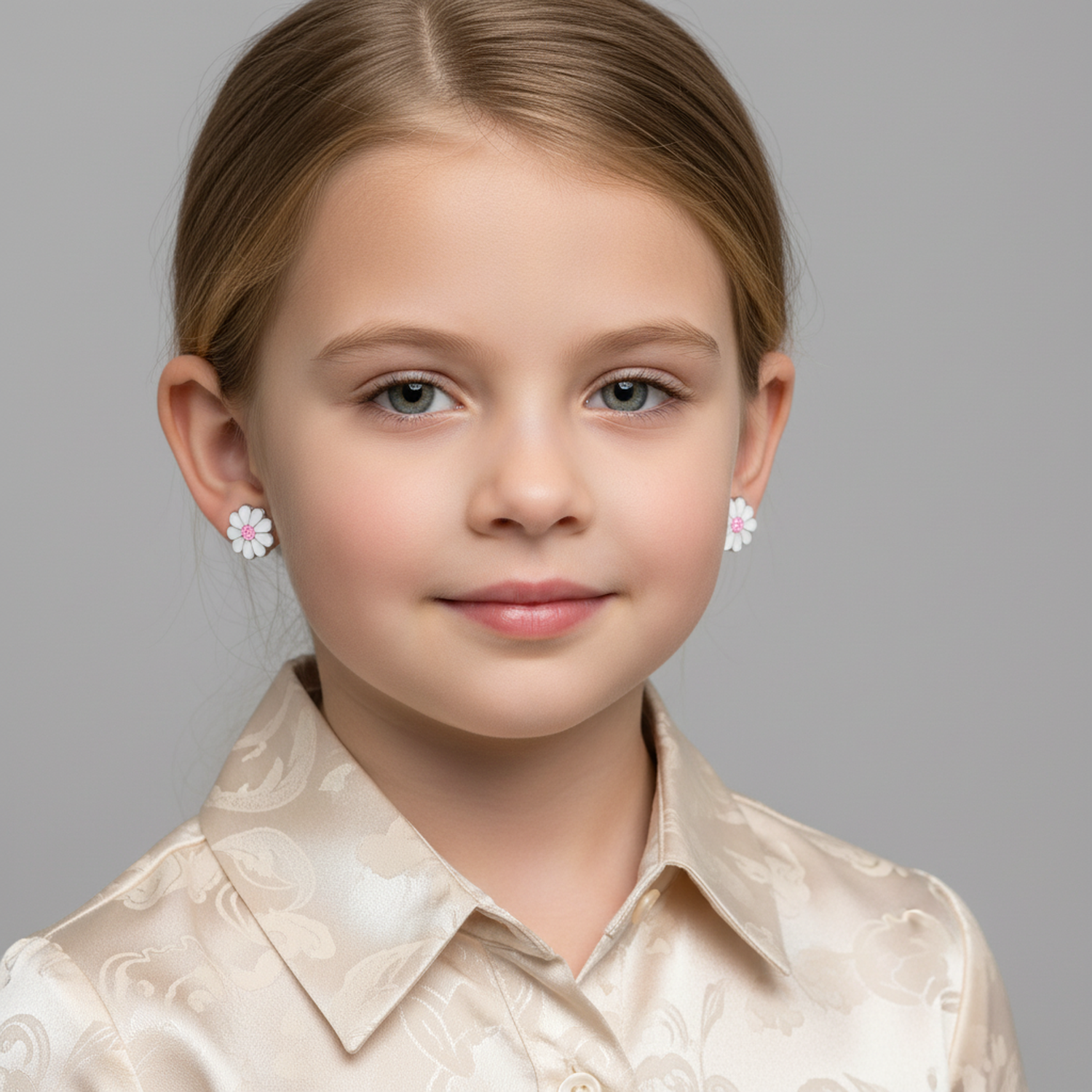 Melchior Jewellery sterling silver daisy earrings for children UK worn by young girl with beige shirt