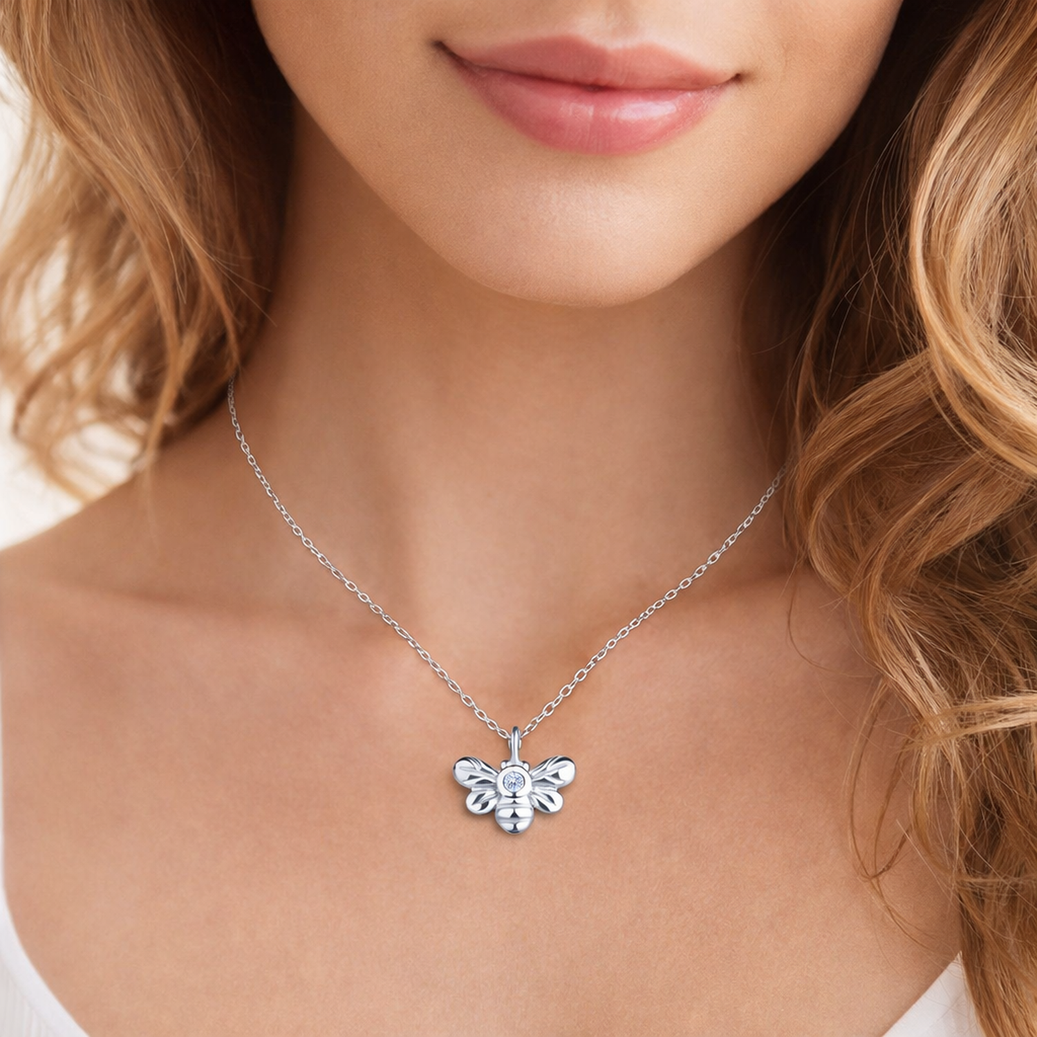 Sterling Silver Diamond Bee Pendant Necklace by Melchior Jewellery worn on model's neck