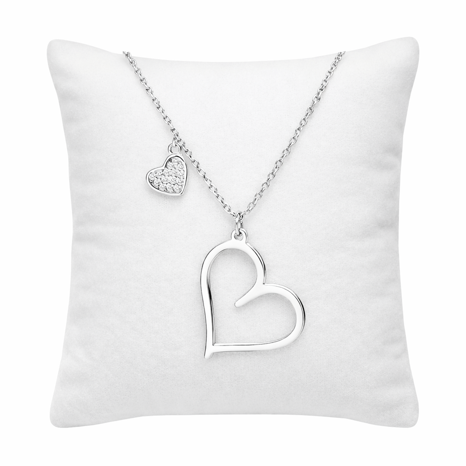 Sterling silver double heart necklace by Melchior Jewellery displayed on white cushion
