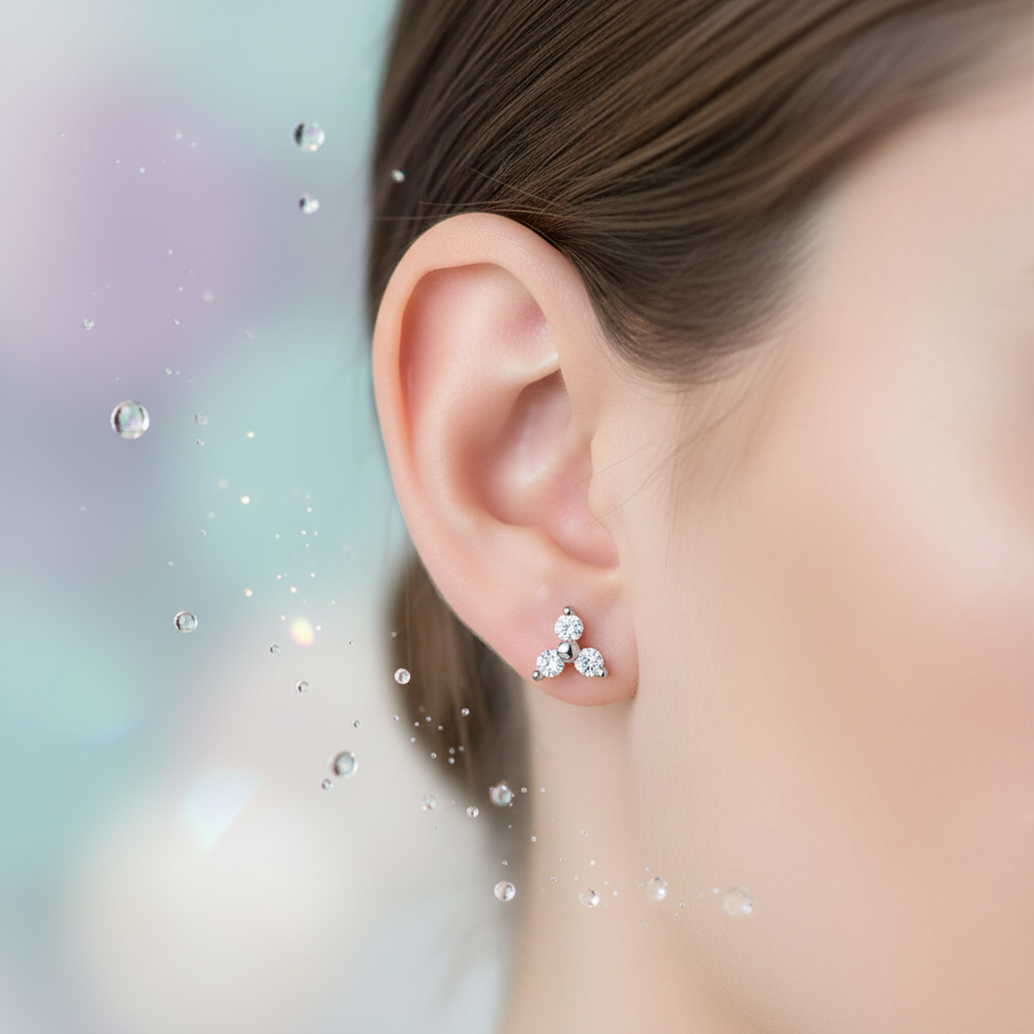Sterling silver geometric with titanium labret tri-stone stud earring on ear by Melchior Jewellery
