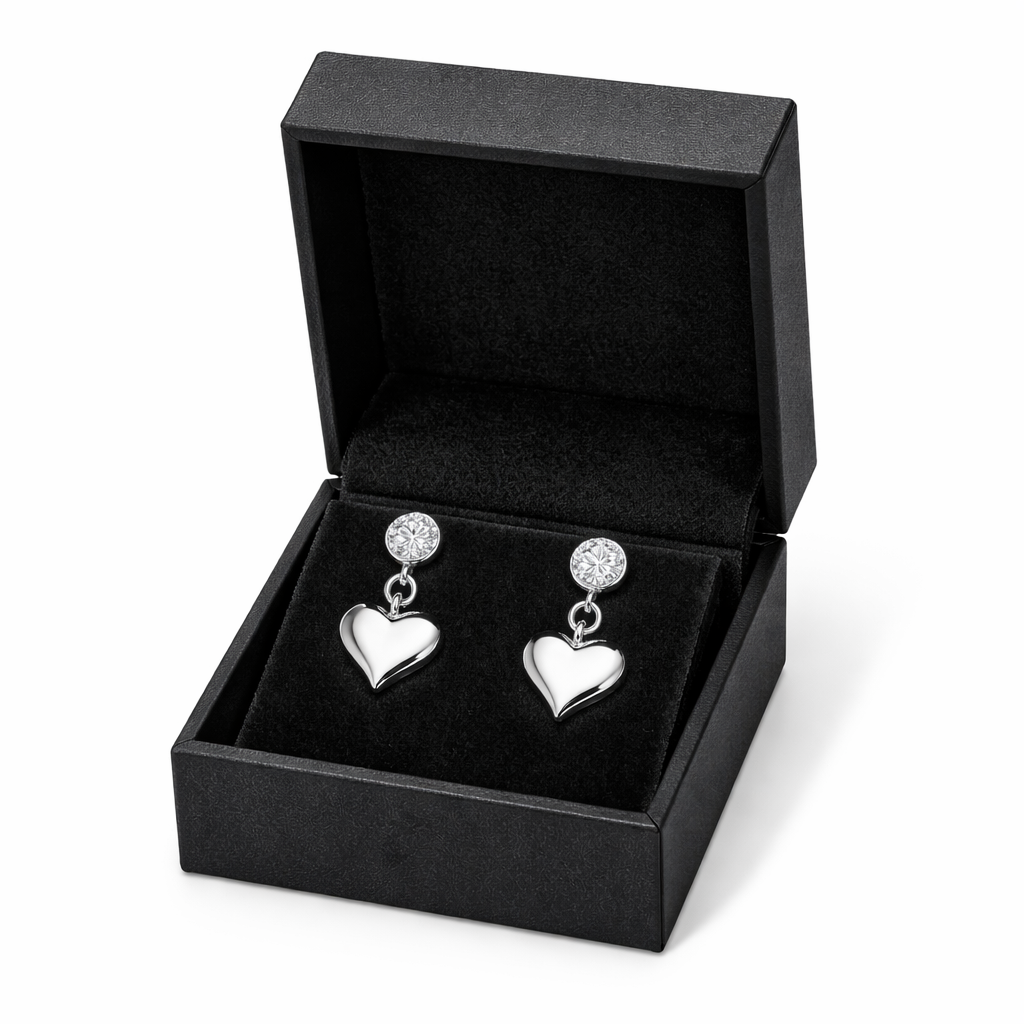 Melchior Jewellery sterling silver heart drop earrings displayed in a black velvet jewellery box