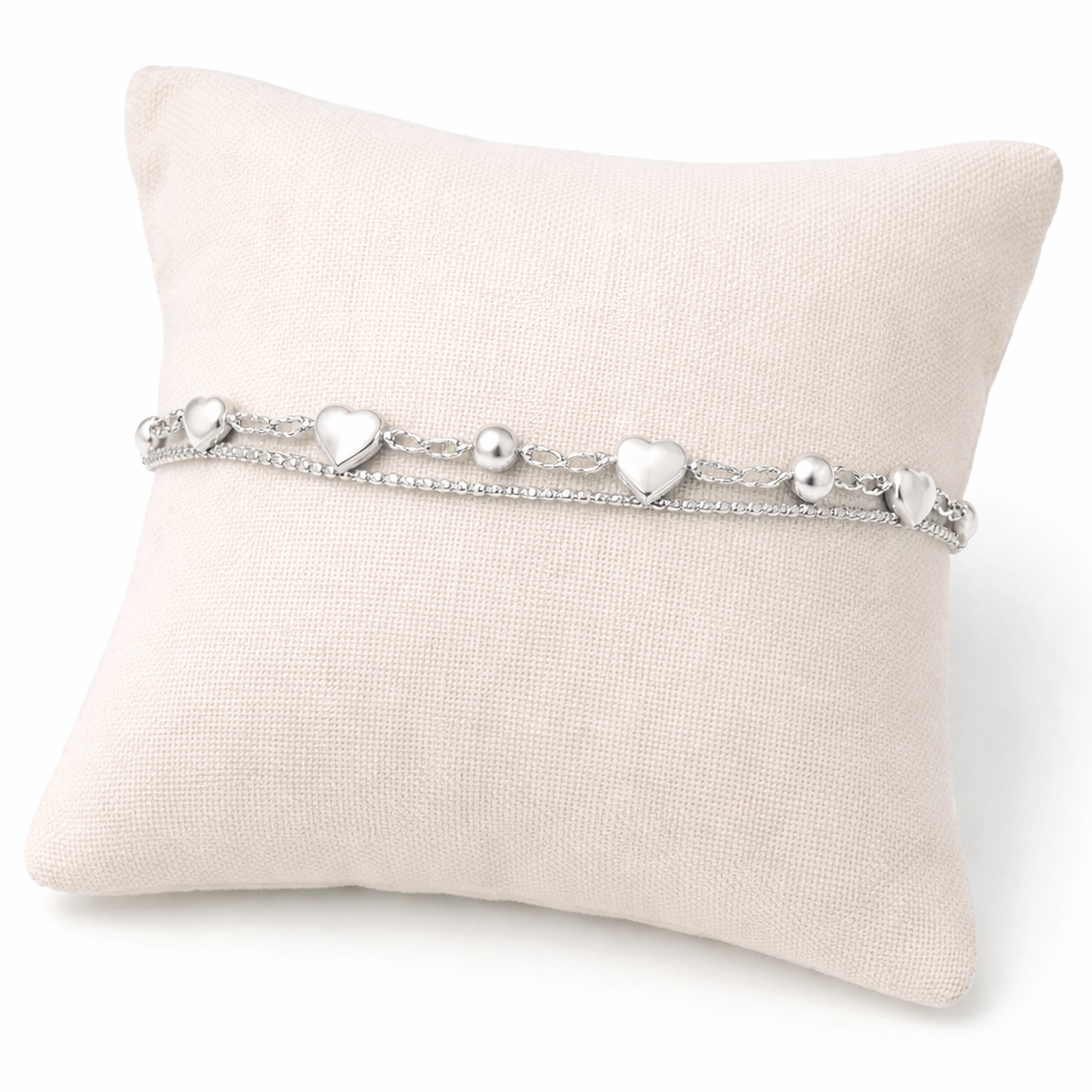 Melchior Jewellery sterling silver hearts bracelet displayed on a cream cushion for women