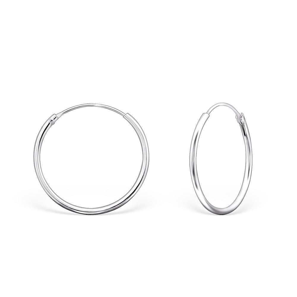 Melchior Jewellery sterling silver hoop earrings polished round womens hoops shown flat and angled on white background