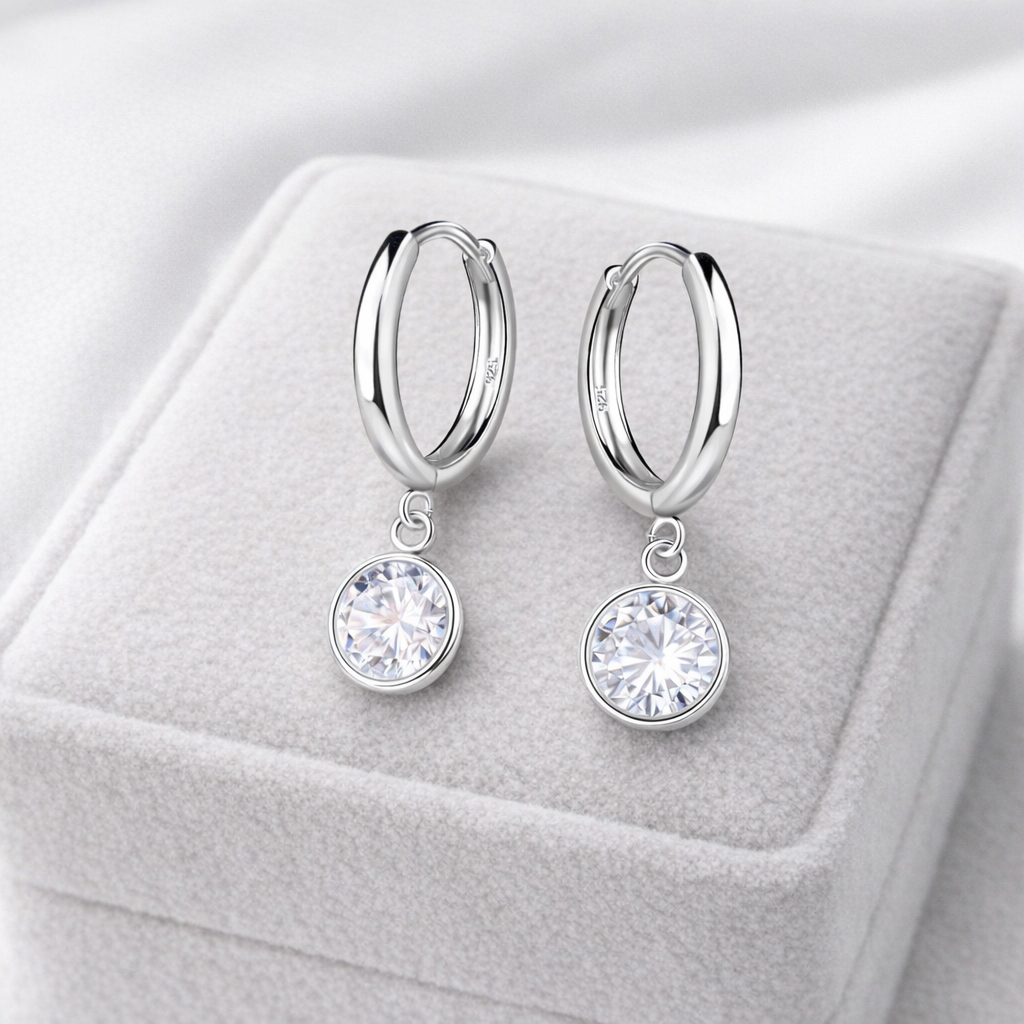 Sterling silver huggie hoop earrings with sparkling clear crystal dangles by Melchior Jewellery