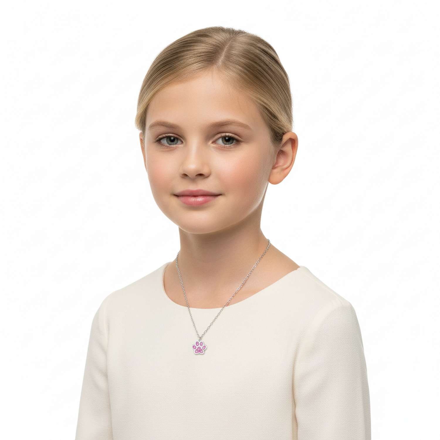 Young girl wearing a sterling silver kids necklace with a purple paw pendant by Melchior Jewellery