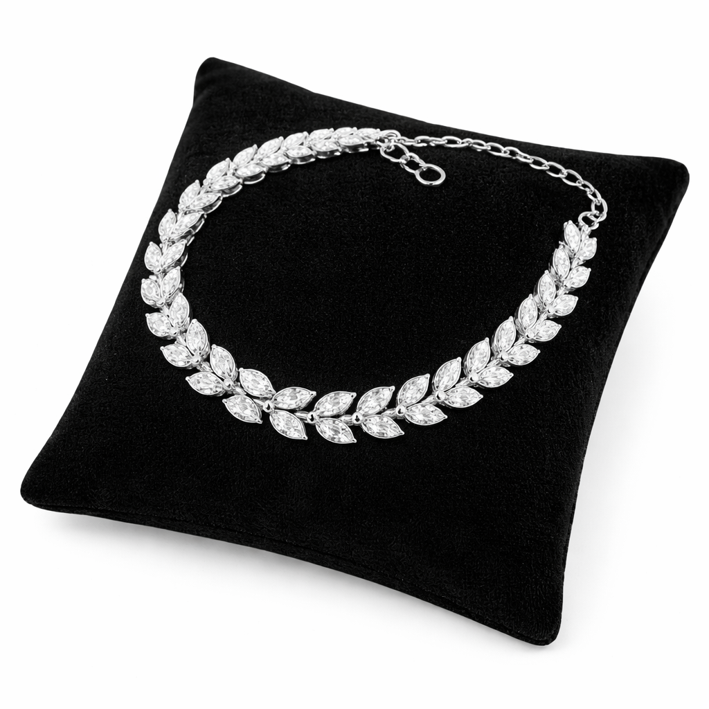 Sterling silver leaf bracelet by Melchior Jewellery displayed on black cushion