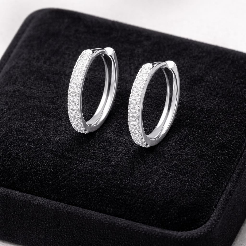 Melchior Jewellery Sterling Silver Luxe Halo Huggies earrings displayed on black velvet