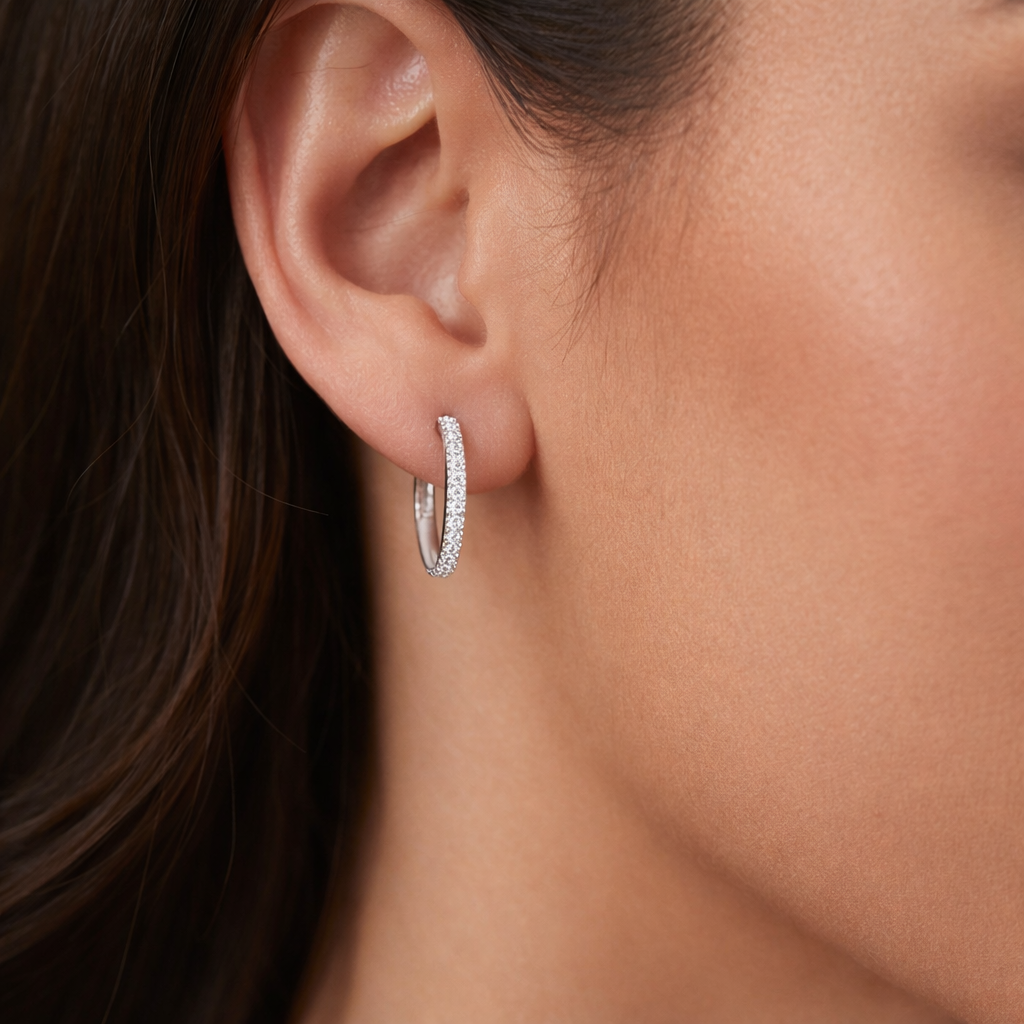 Melchior Jewellery Sterling Silver Luxe Halo Huggies earrings worn on ear with sparkling stones