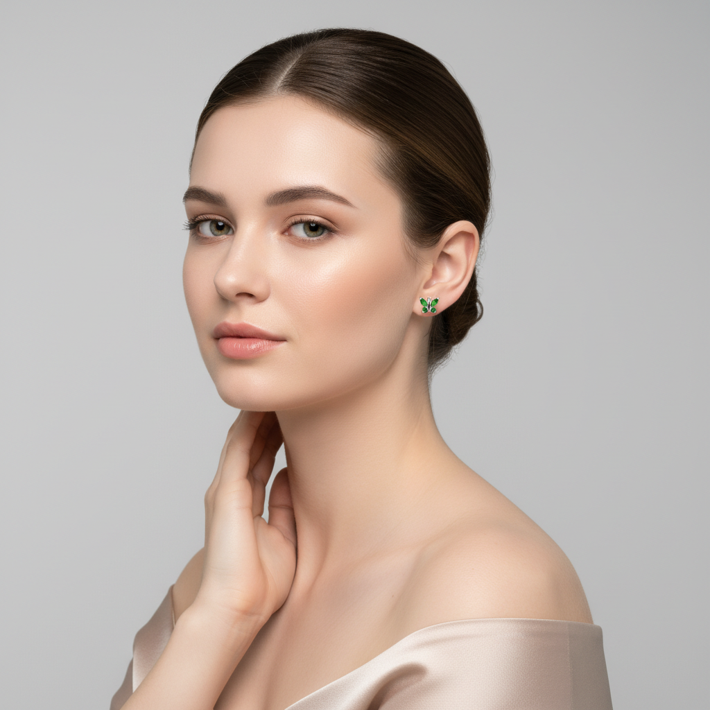 Melchior Jewellery woman wearing sterling silver May birthstone earrings with green stones