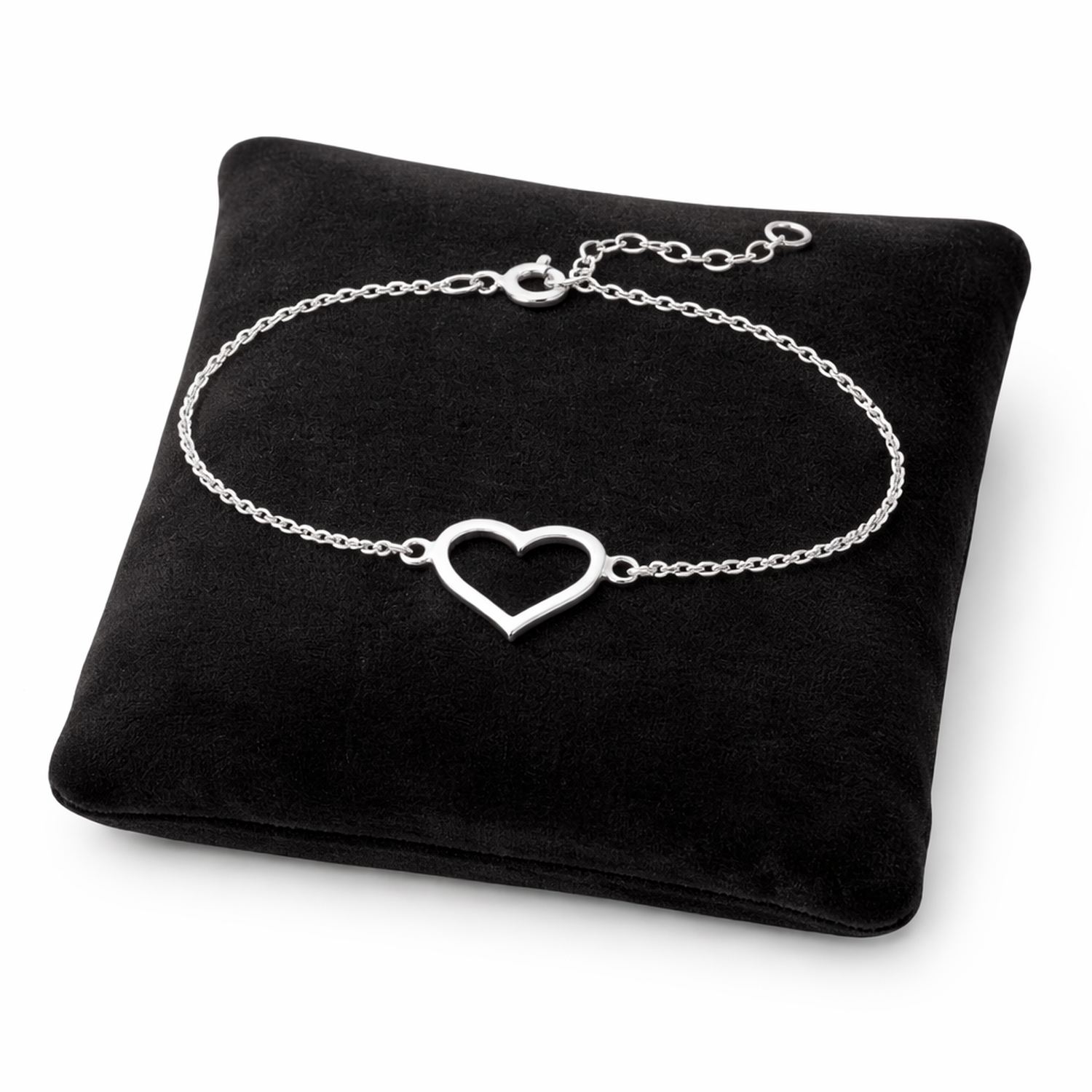 Sterling silver open heart bracelet by Melchior Jewellery displayed on black cushion