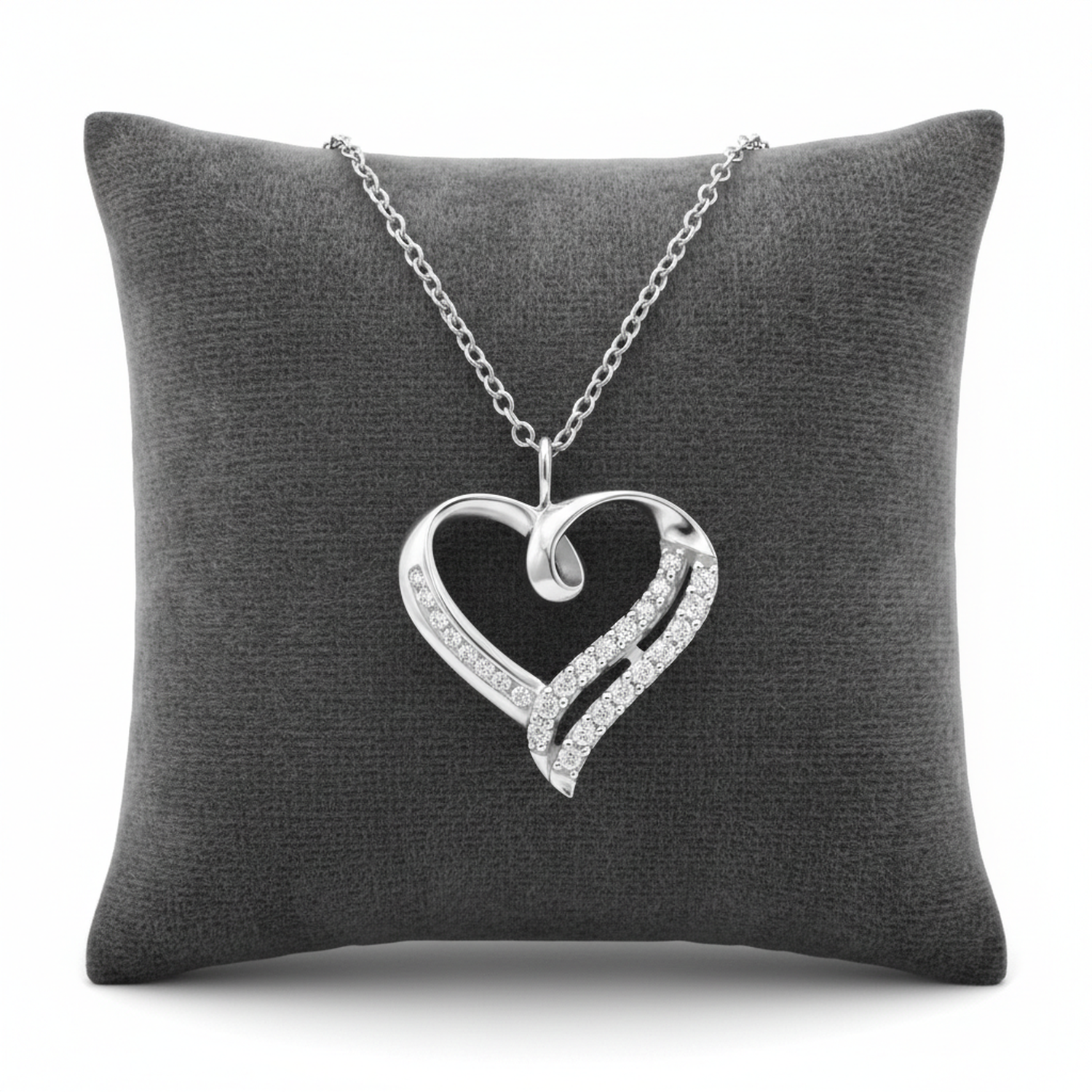 Melchior Jewellery sterling silver open heart necklace with crystal accents displayed on grey cushion