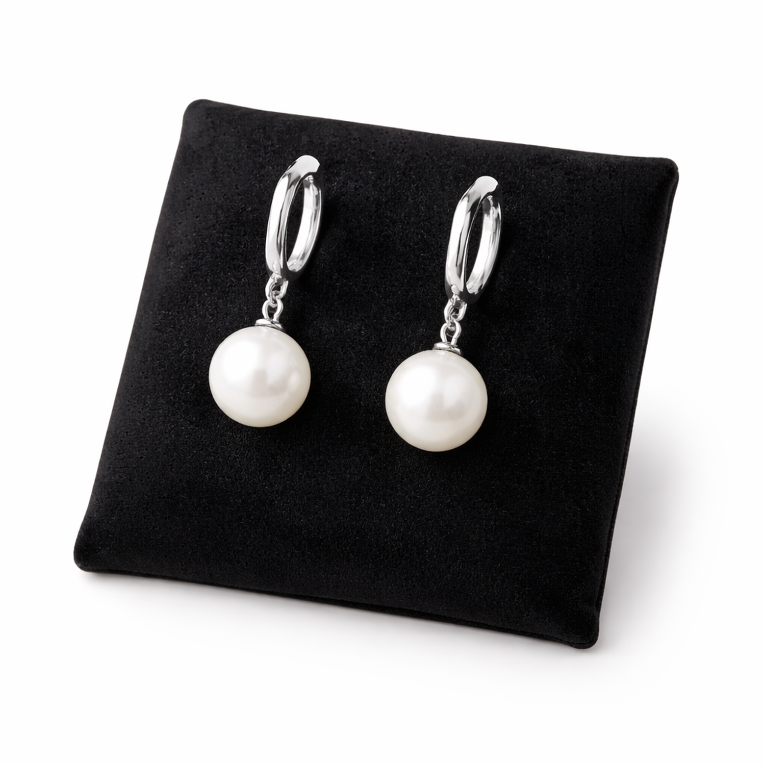 Melchior Jewellery sterling silver pearl drop earrings displayed on black cushion