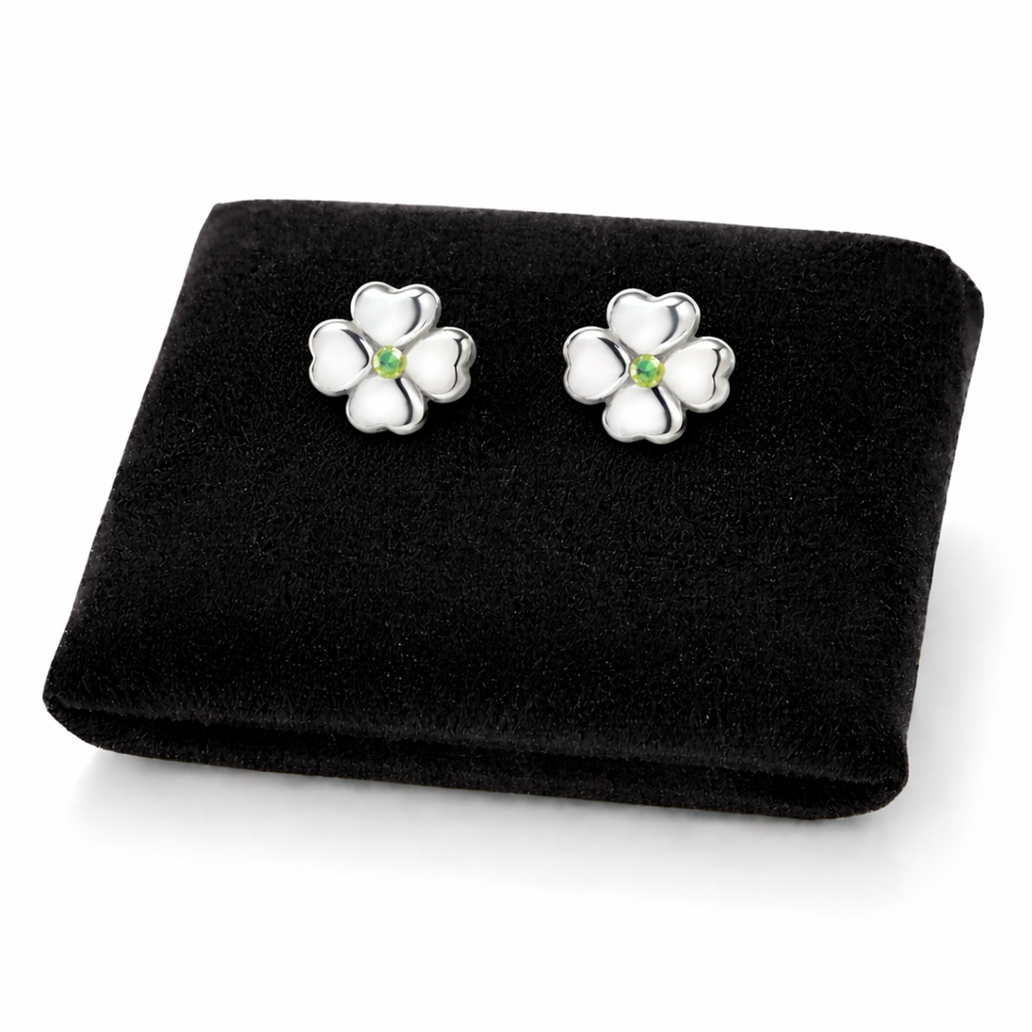 Melchior Jewellery sterling silver peridot stud earrings shaped like delicate four-leaf flowers