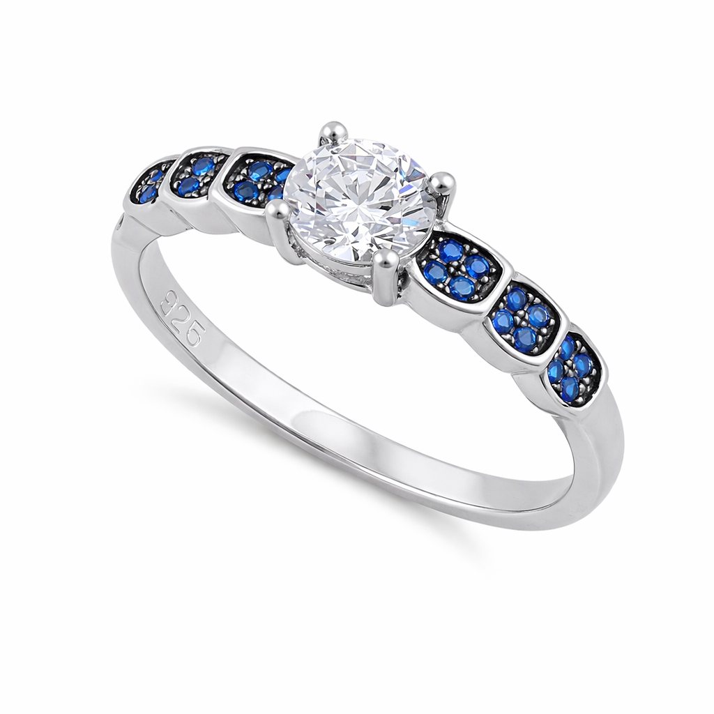 Melchior Jewellery sterling silver sapphire engagement ring with central clear stone and blue sapphire accents