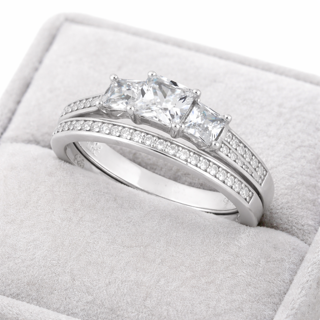 Sterling silver triple CZ engagement ring set by Melchior Jewellery displayed in a grey velvet ring box