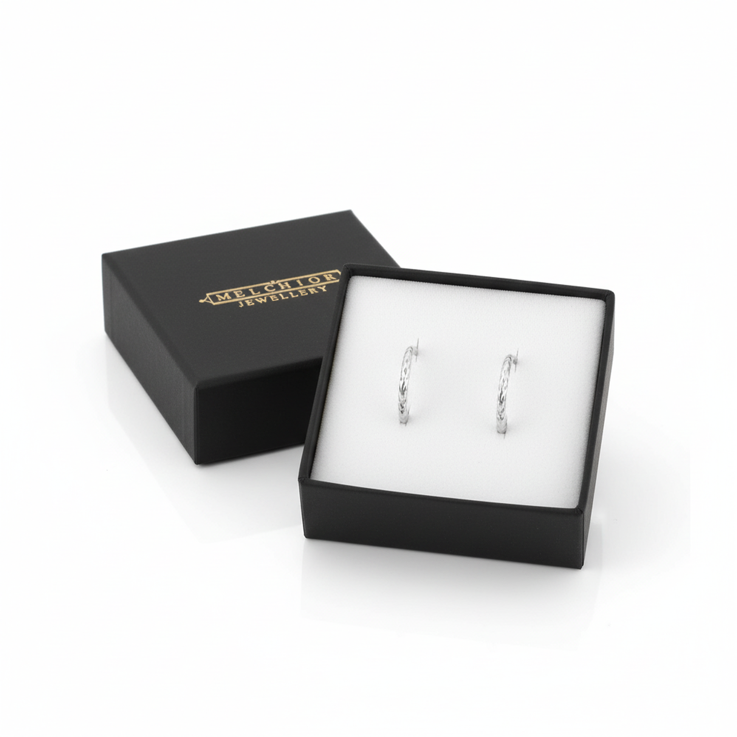 Melchior Jewellery tiny diamond cut hoop earrings for kids in black gift box on white background
