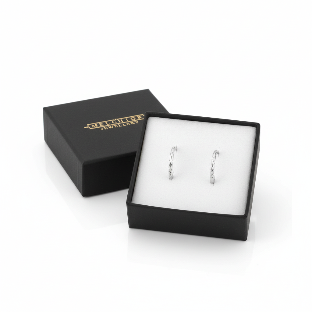 Melchior Jewellery tiny diamond cut hoop earrings for kids in black gift box on white background