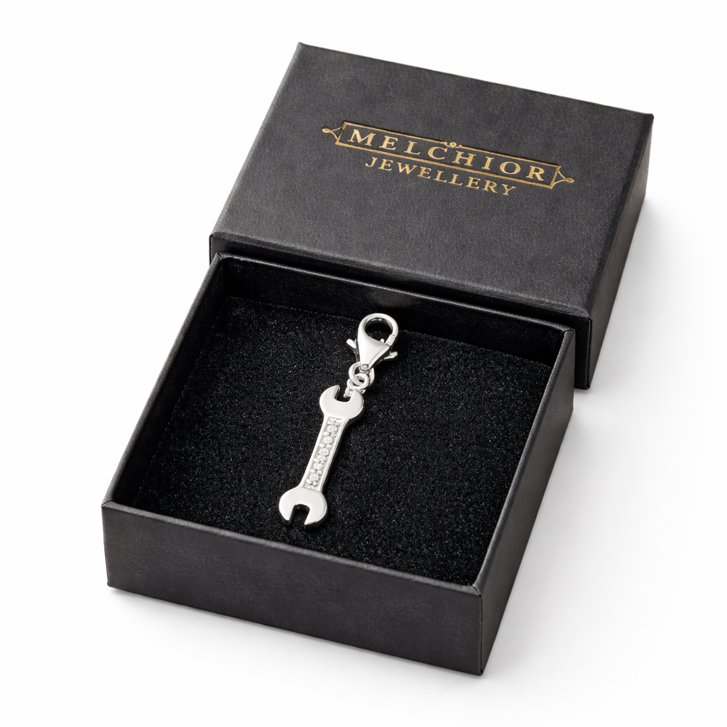 Silver tool clip on charm for bracelets shaped like a wrench with small crystals in black Melchior Jewellery box
