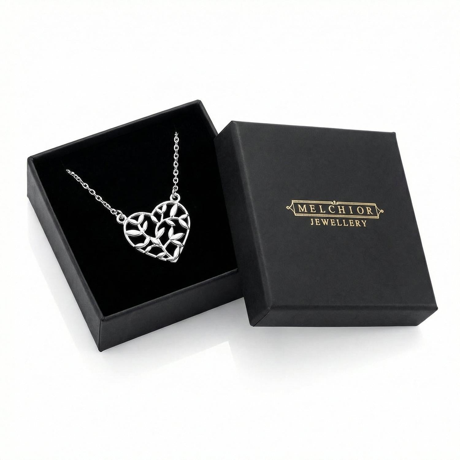 Sterling silver olive leaf pendant necklace in heart shape presented in black Melchior Jewellery gift box