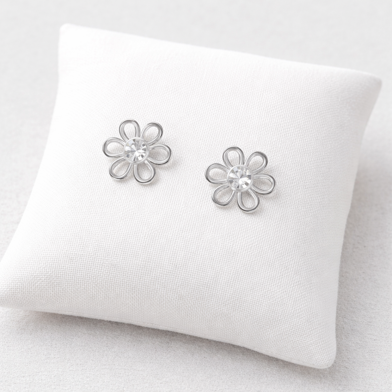 Sterling silver crystal stud earrings for kids shaped like delicate flowers by Melchior Jewellery