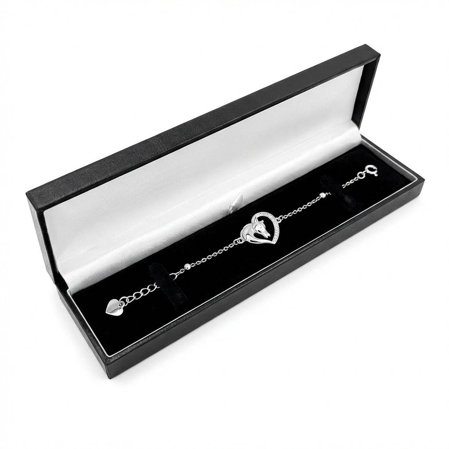 Sterling silver heritage stallion bracelet with horse head inside heart charm, presented in black and white luxury box
