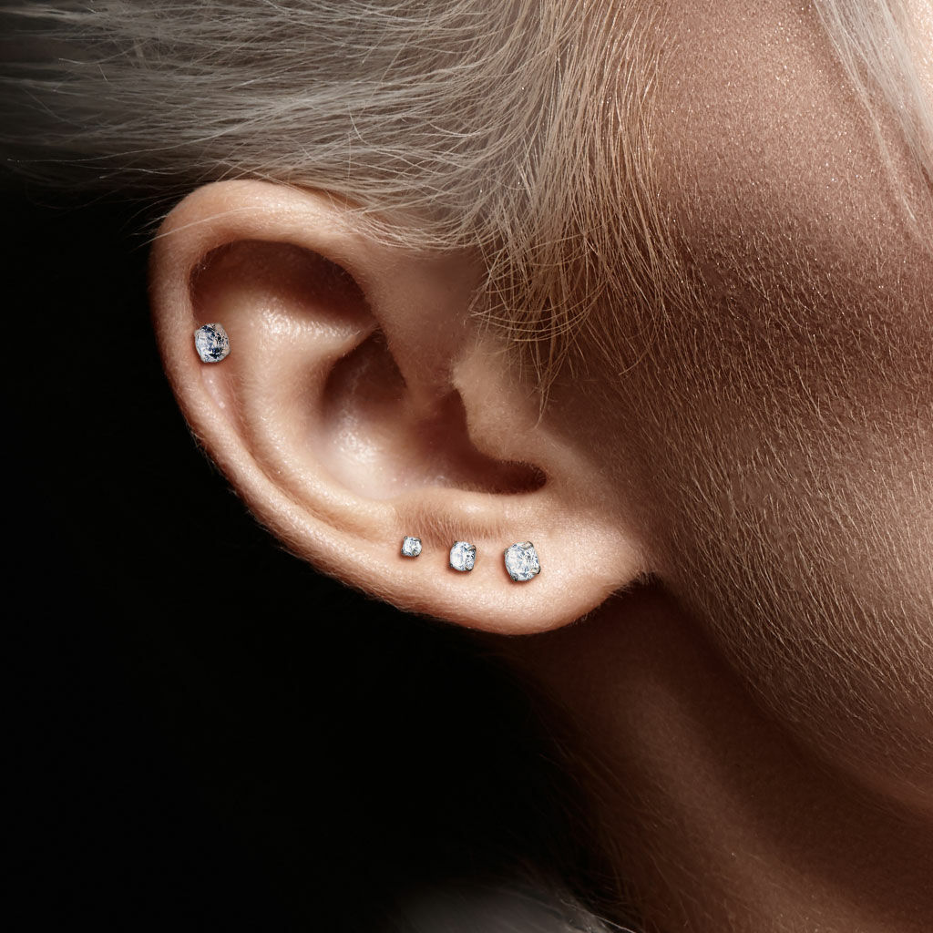 Melchior Jewellery ear with multiple studs including steel labret with cubic zirconia top and graduated lobe stones