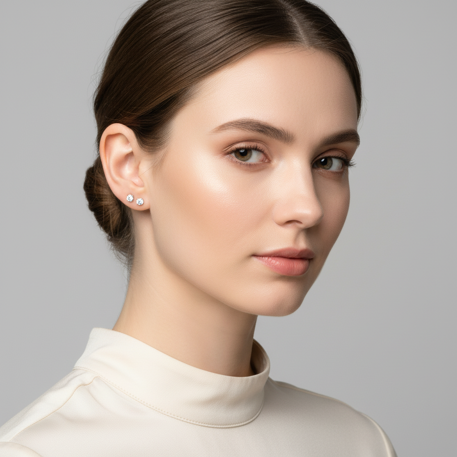 Melchior Jewellery sterling silver cubic zirconia stud earrings worn by woman with neutral makeup