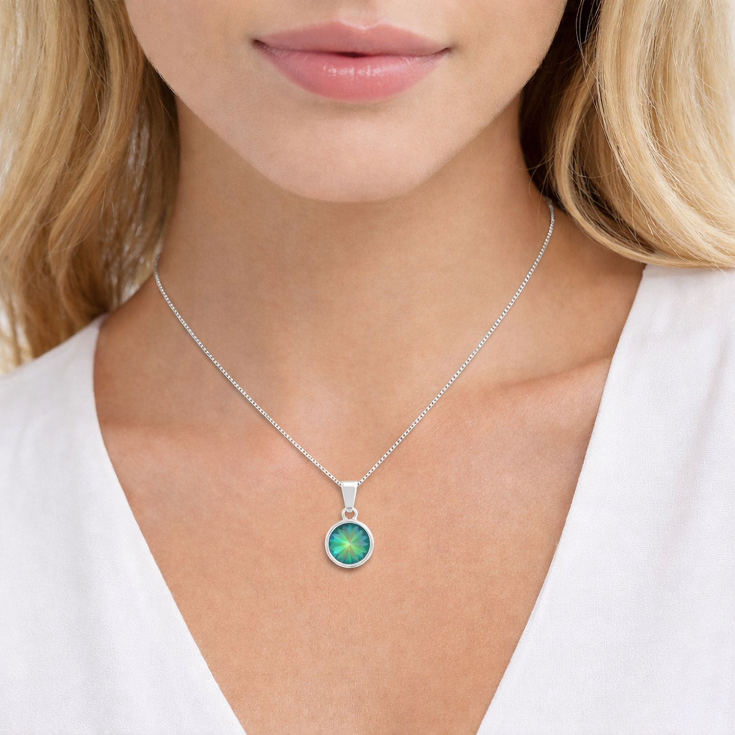 Melchior Jewellery sterling silver necklace with Swarovski crystals featuring a green round pendant worn by woman