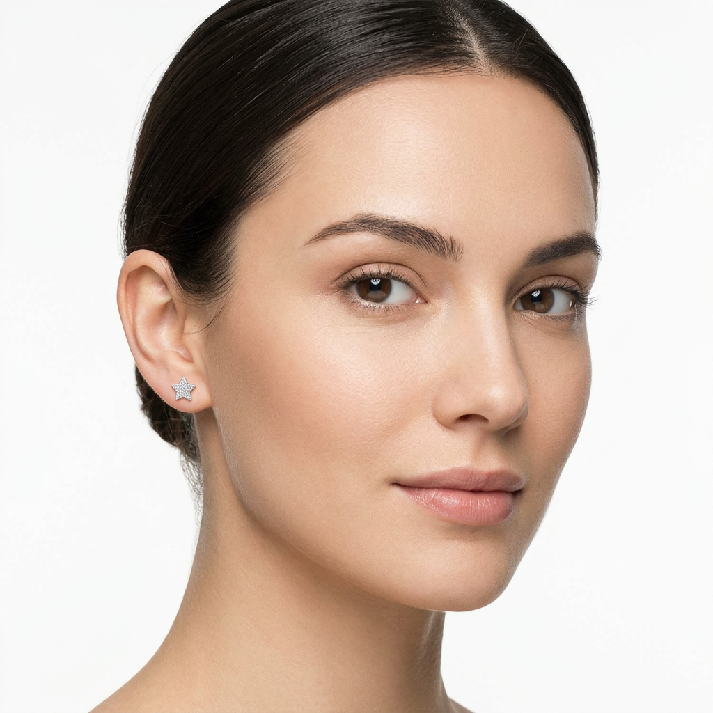 Melchior Jewellery sterling silver star stud earrings worn by a woman with clear skin and dark hair
