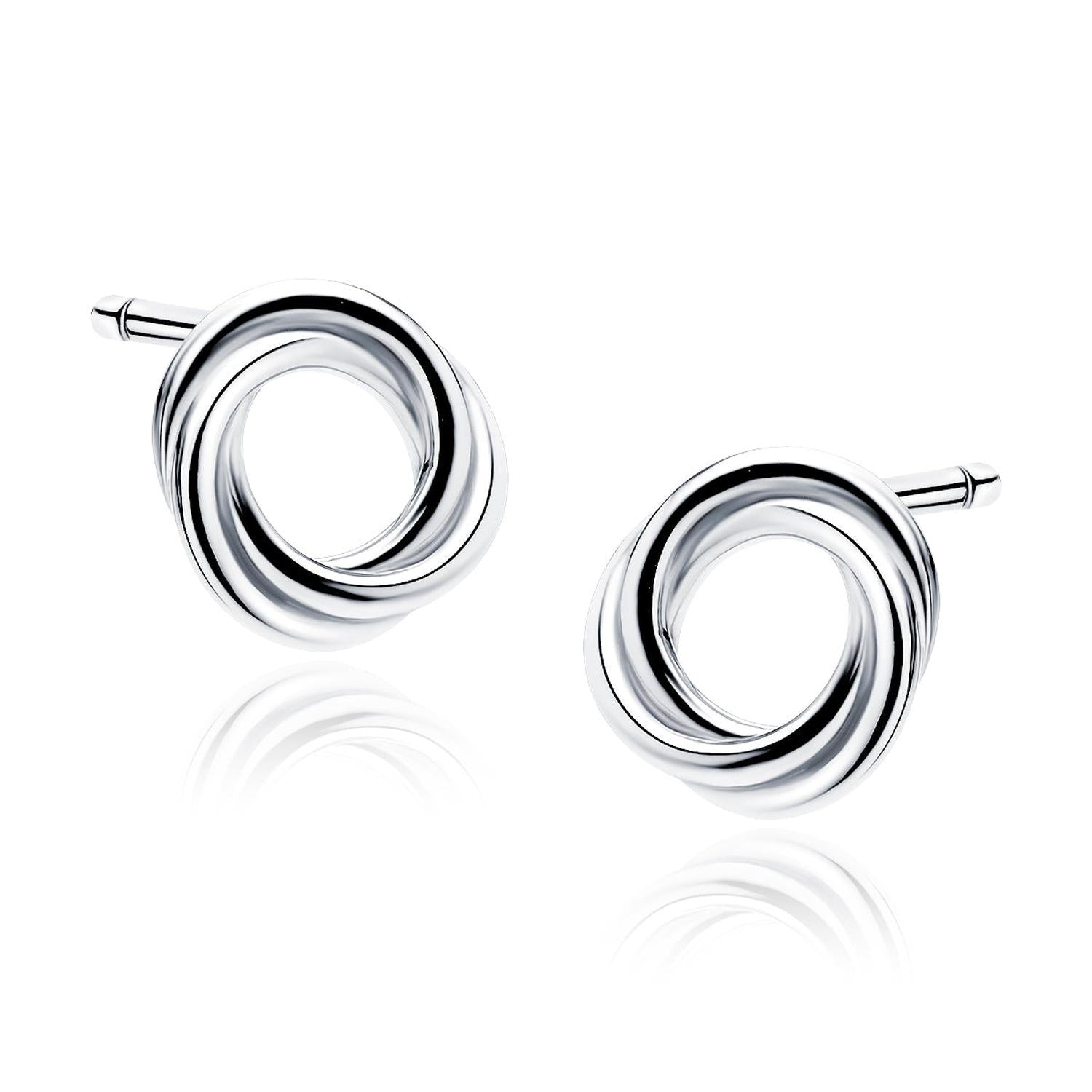 Melchior Jewellery silver hoop earrings with a polished twisted knot design and reflective shiny finish