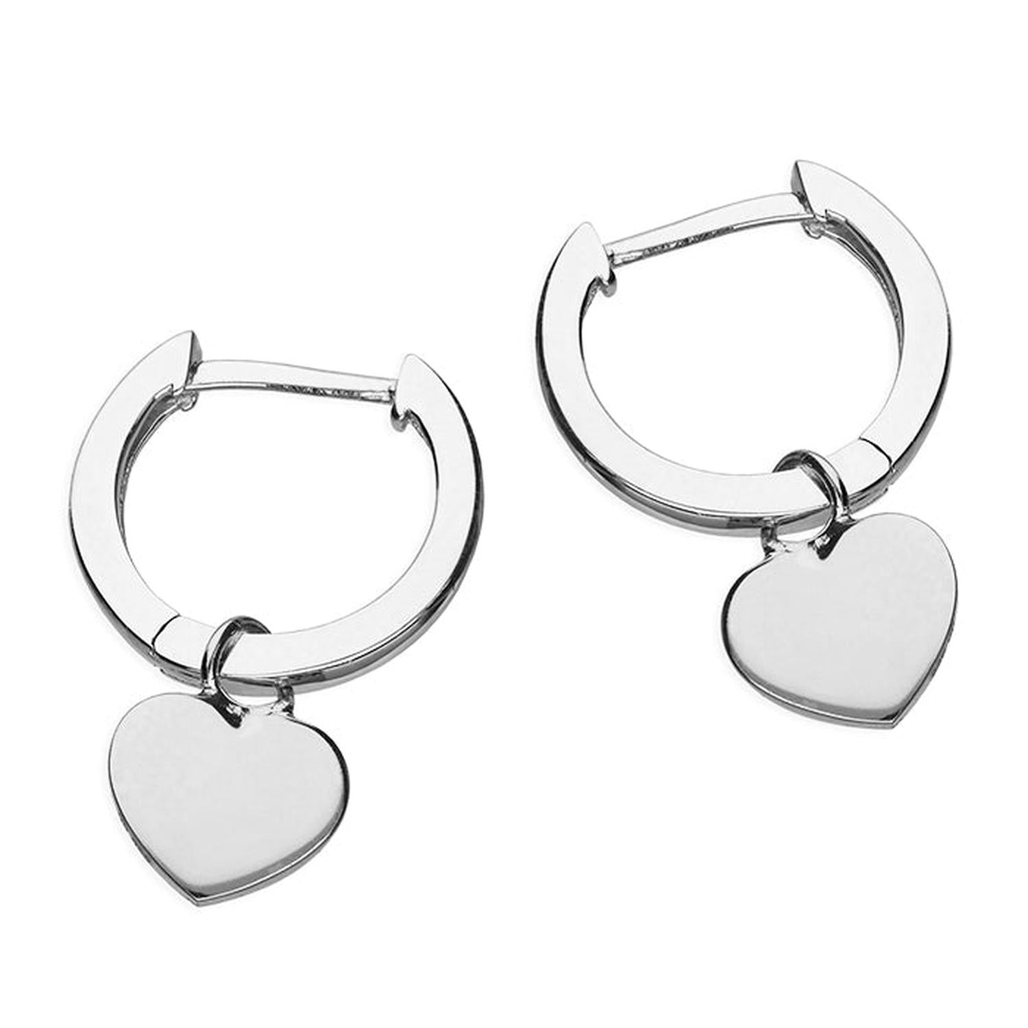 Sterling silver heart huggie earrings by Melchior Jewellery with polished heart charm on small hoop