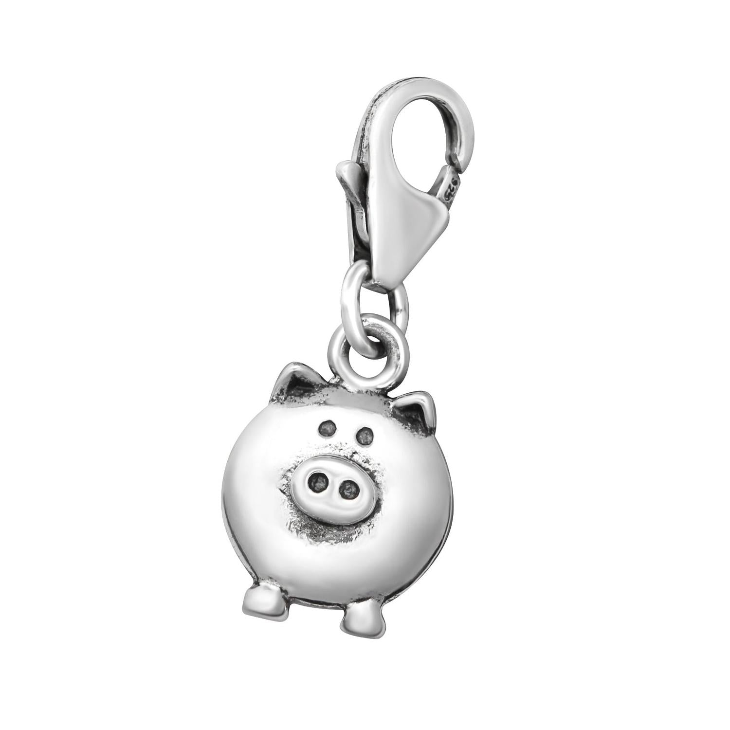 Shiny sterling silver pig clip on charm by Melchior Jewellery with detailed snout and clasp