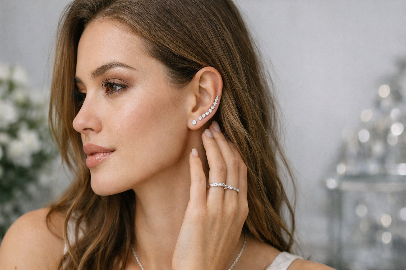 Elegant Pearl Ear Cuff showcasing a model with soft makeup and long hair.