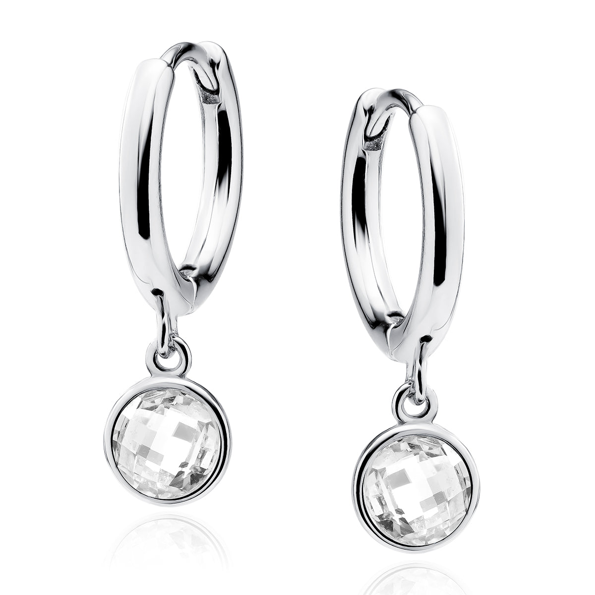 A pair of polished silver huggie hoop earrings with a dangling round bezel-set clear faceted gemstone
