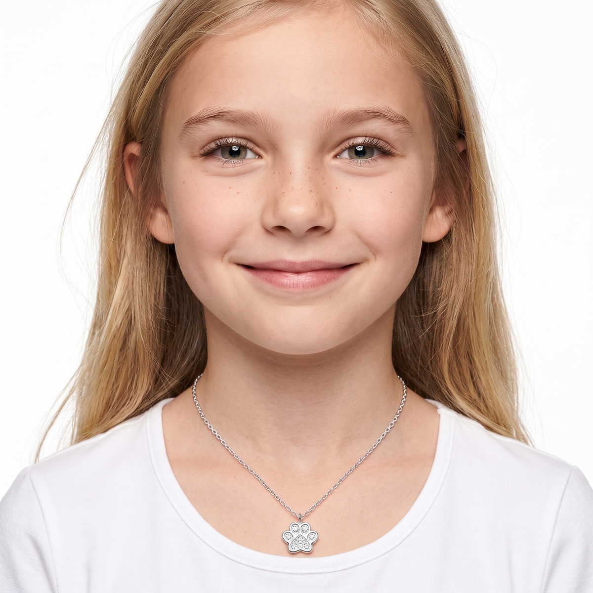 A young girl with blonde hair wearing a silver paw-shaped pendant necklace 