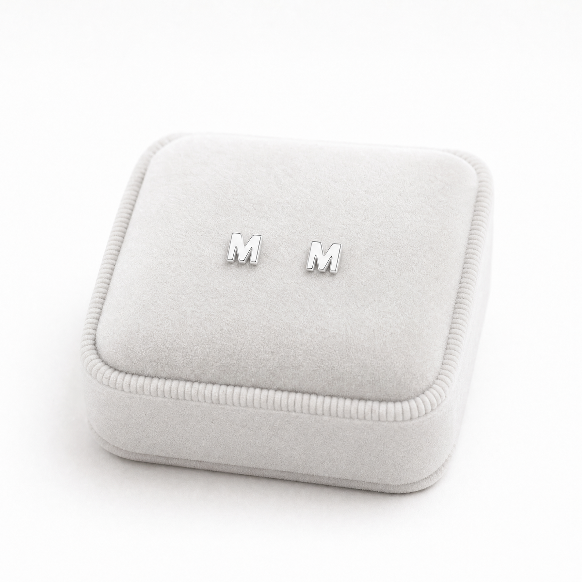 Girls sterling silver M initial stud on jeweearringslery cushion