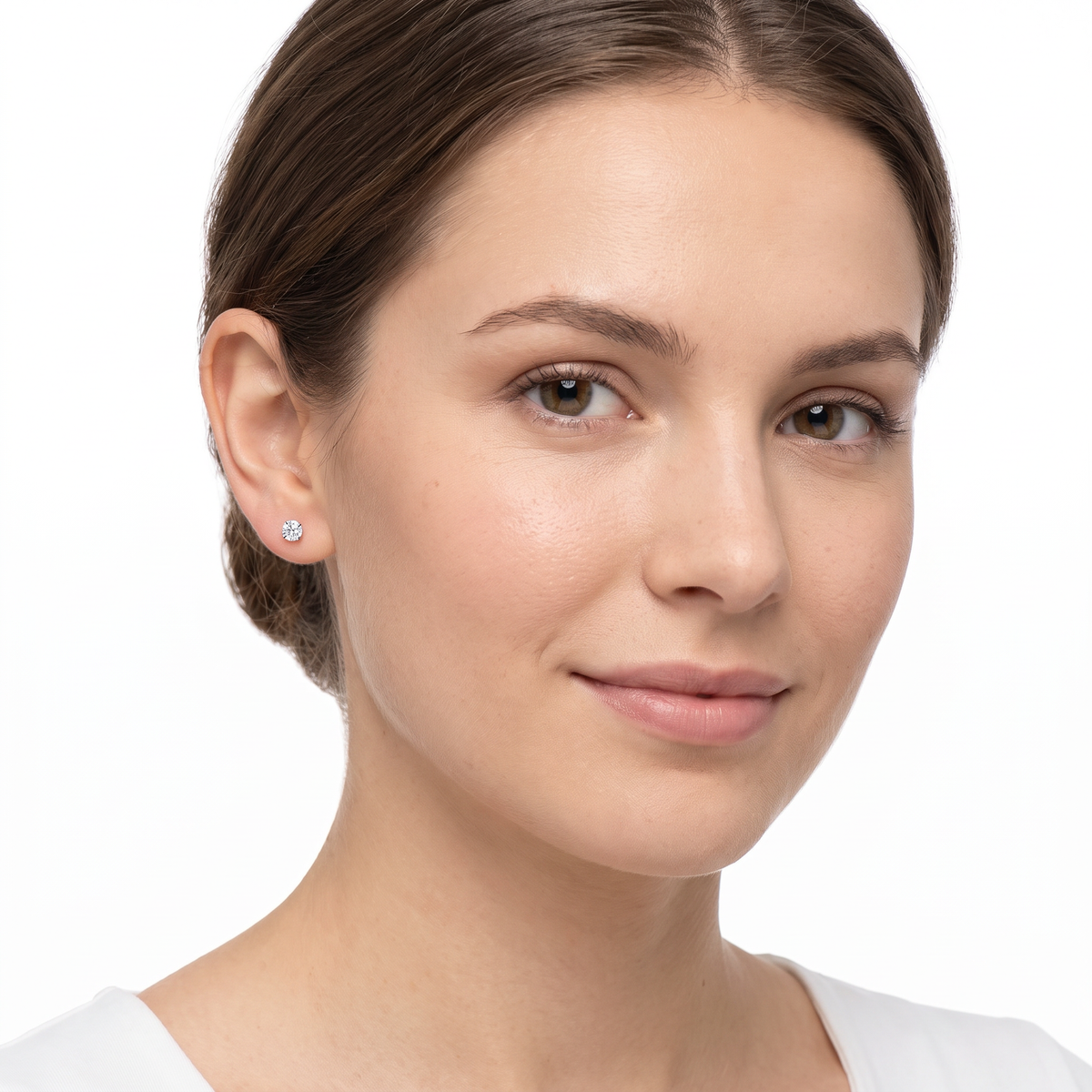 Sterling silver 3mm round moissanite stud earrings on woman