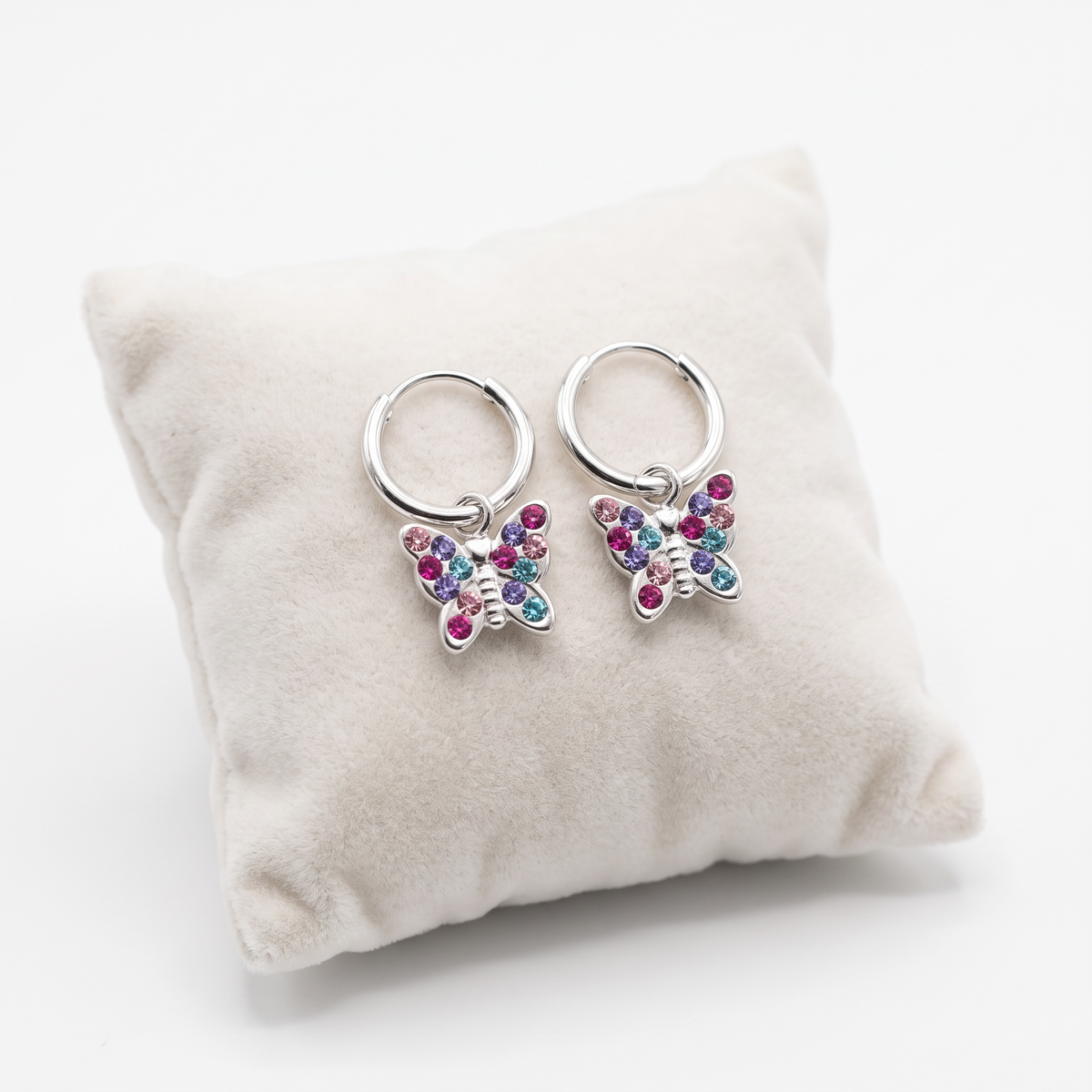 Girls sterling silver sparkly CZ butterfly earrings on cushion