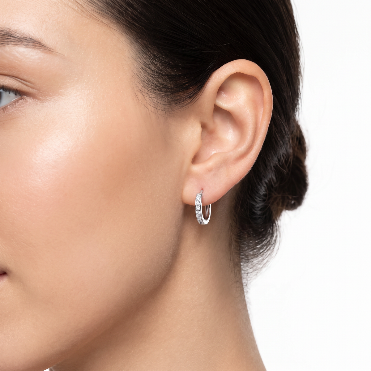 Sterling silver 11mm CZ hinged huggie hoop earrings with sparkling cubic zirconia close up