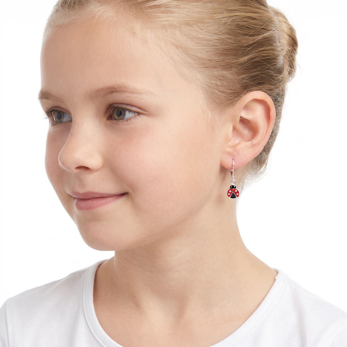 Girls sterling silver ladybird leverback CZ earrings on young 10 year old girl