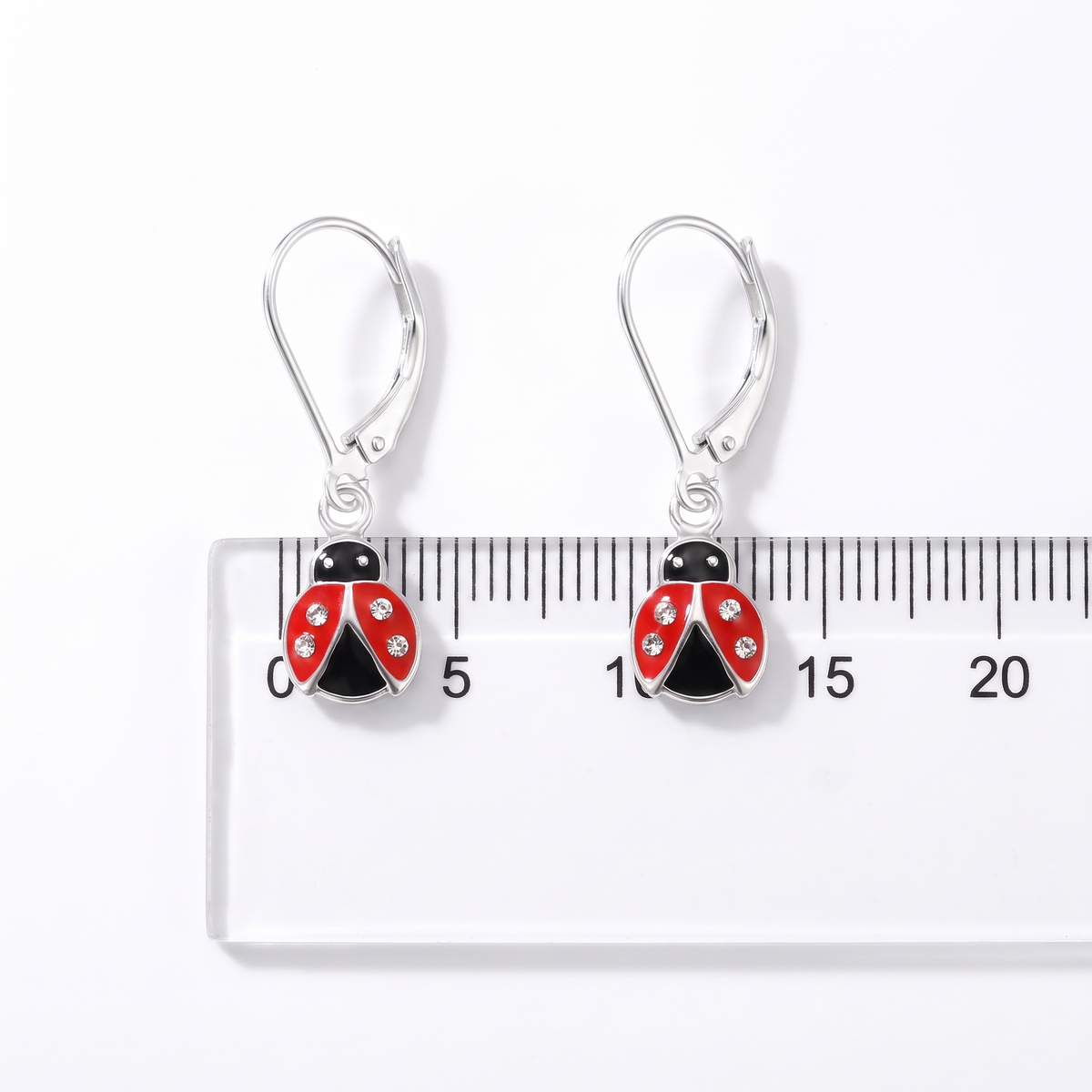 Girls sterling silver ladybird leverback CZ earrings showing size