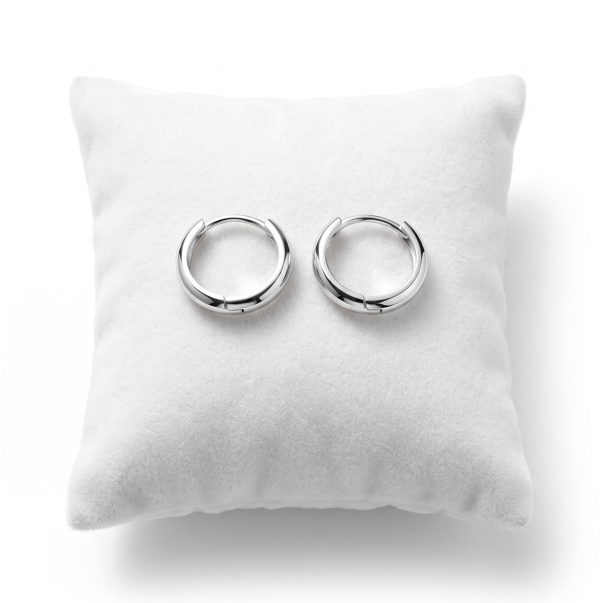 Sterling Silver 13mm Hinged Huggie Hoop Earrings on cushion
