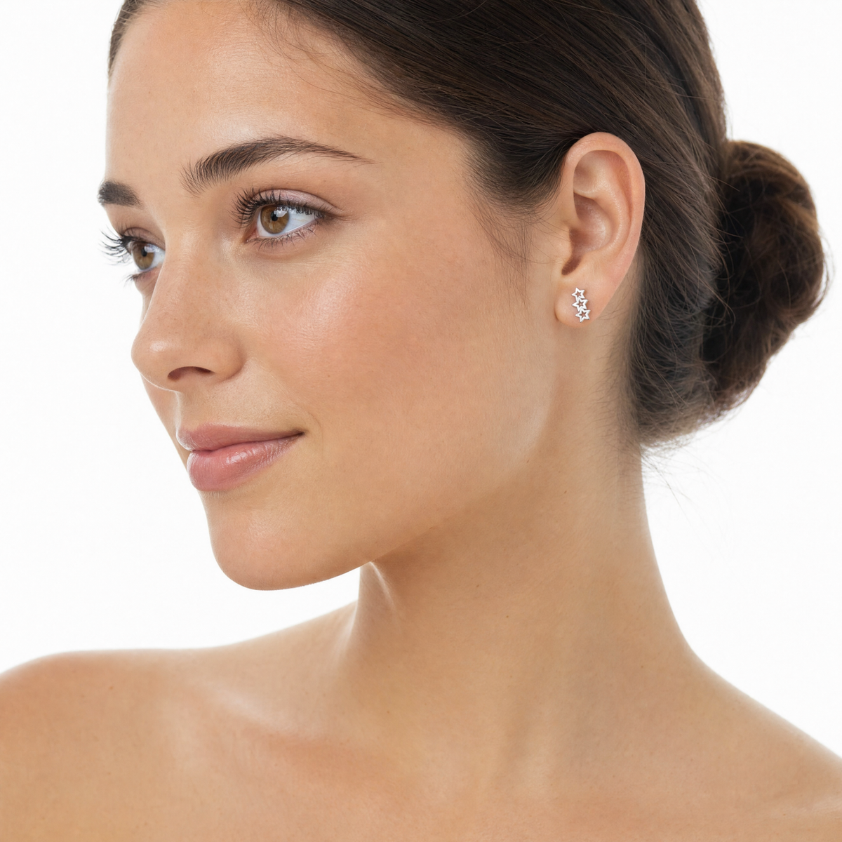 Sterling silver triple star stud earrings on model