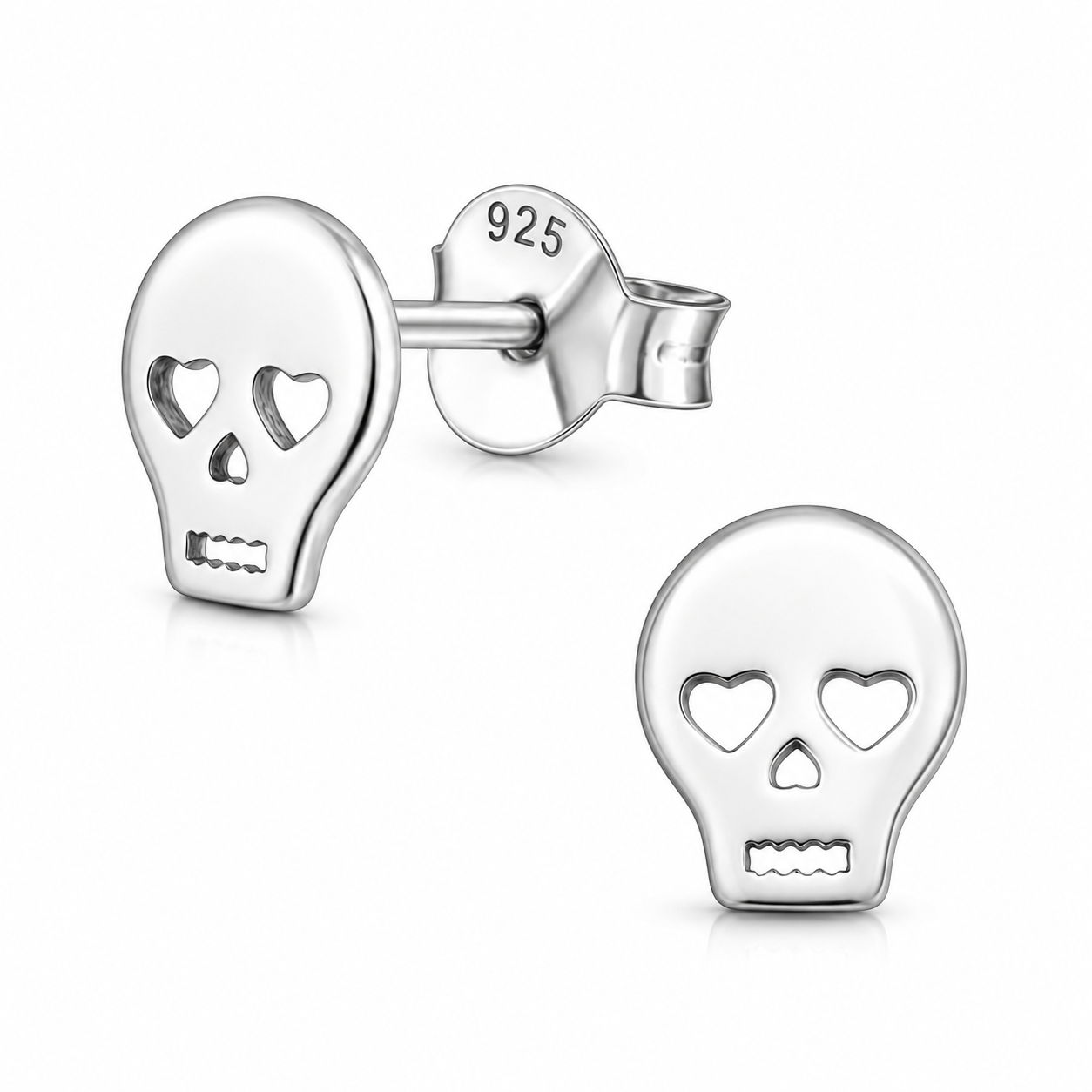 A pair of sterling silver skull stud earrings on a clean white background. One earring is shown from the front displaying the skull face, and the other is shown from the side/back displaying the post and the '925' silver purity stamp.