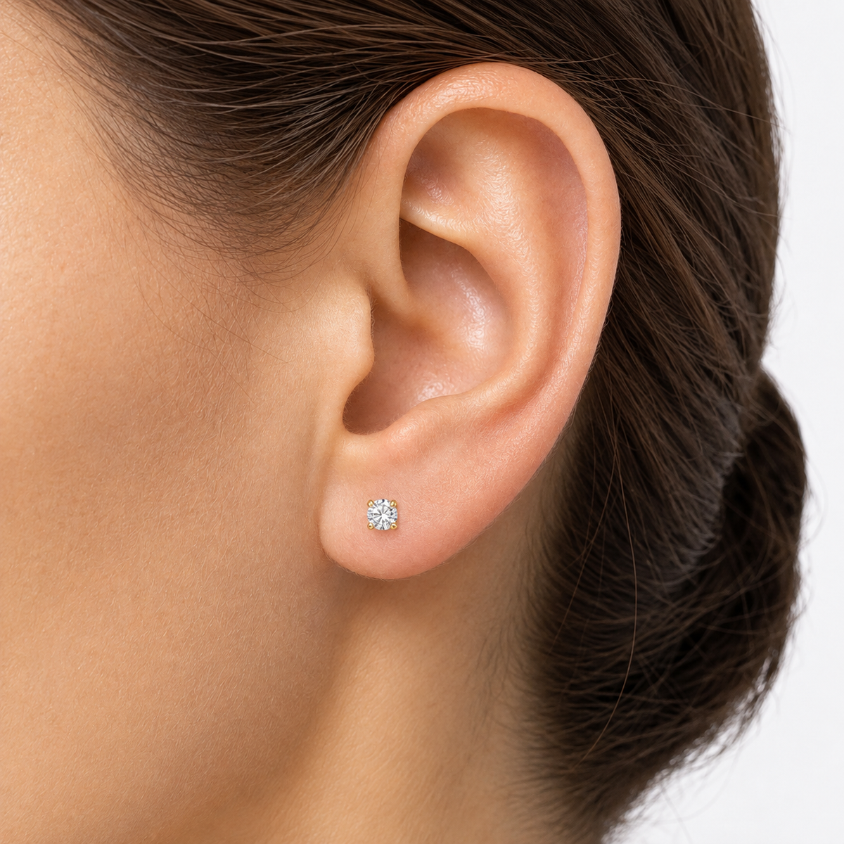 14k yellow gold clear round CZ earrings close up