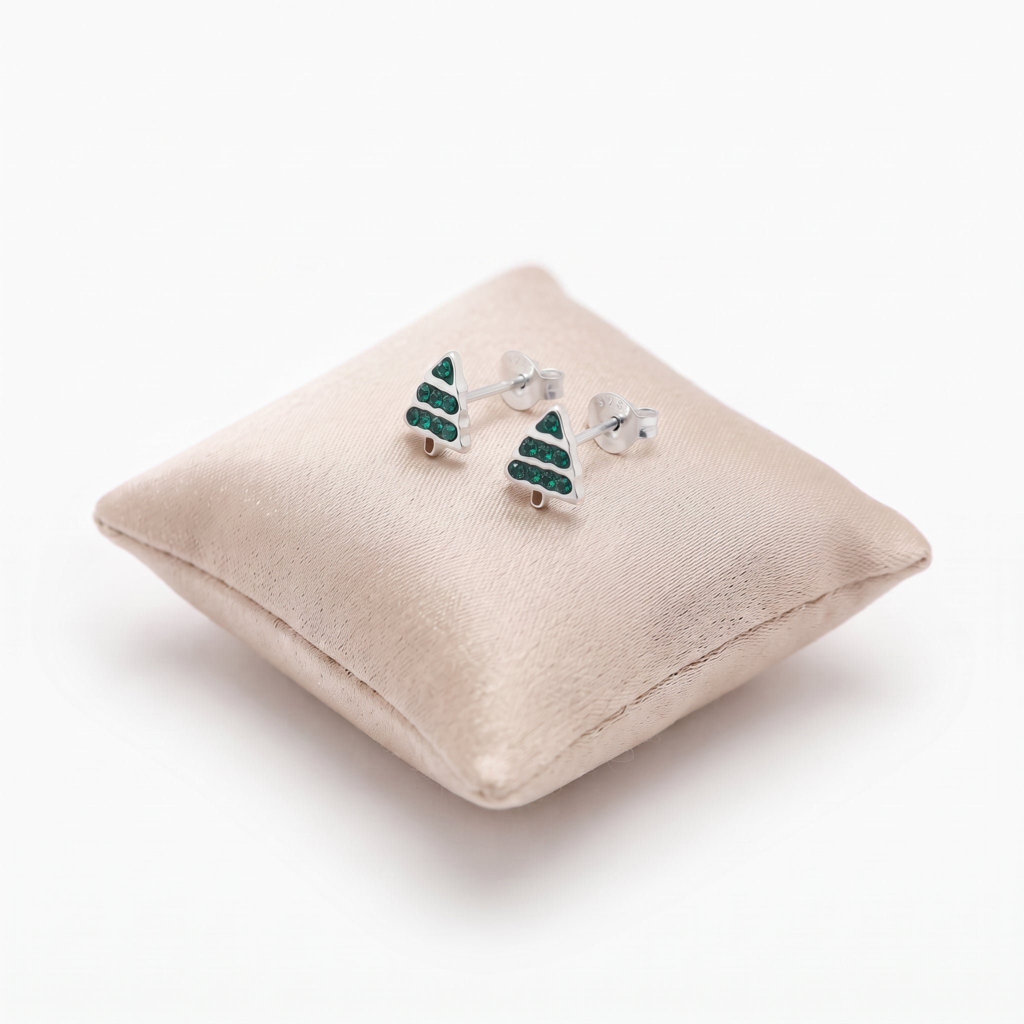 Close-up of children’s Christmas tree stud earrings with sparkling cubic zirconia details